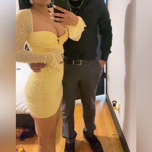 Yellow dress. Worn once. Is missing maybe two-3 rhinestone. Not noticeable